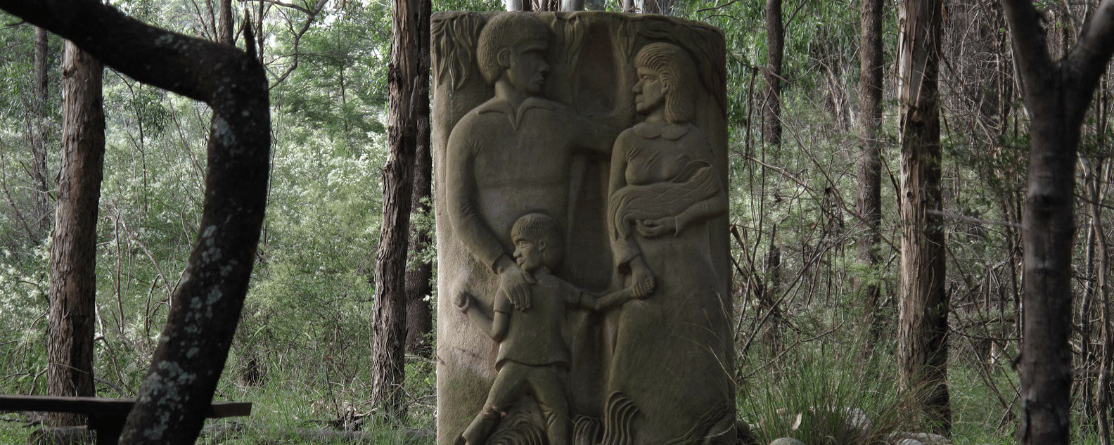 Stolen Generations Sandstone Memorial by Badger Bates in the Cumberland Plain Woodland 