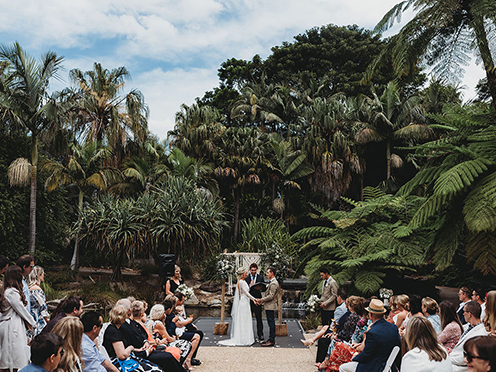 Wedding ceremony with lush garden background