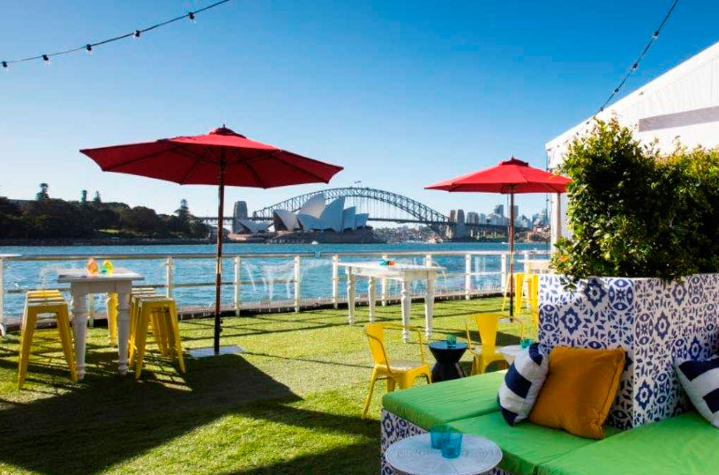 Colourful casual event setting at Fleet Steps on Sydney's harbour with the Harbour Bridge in the background.