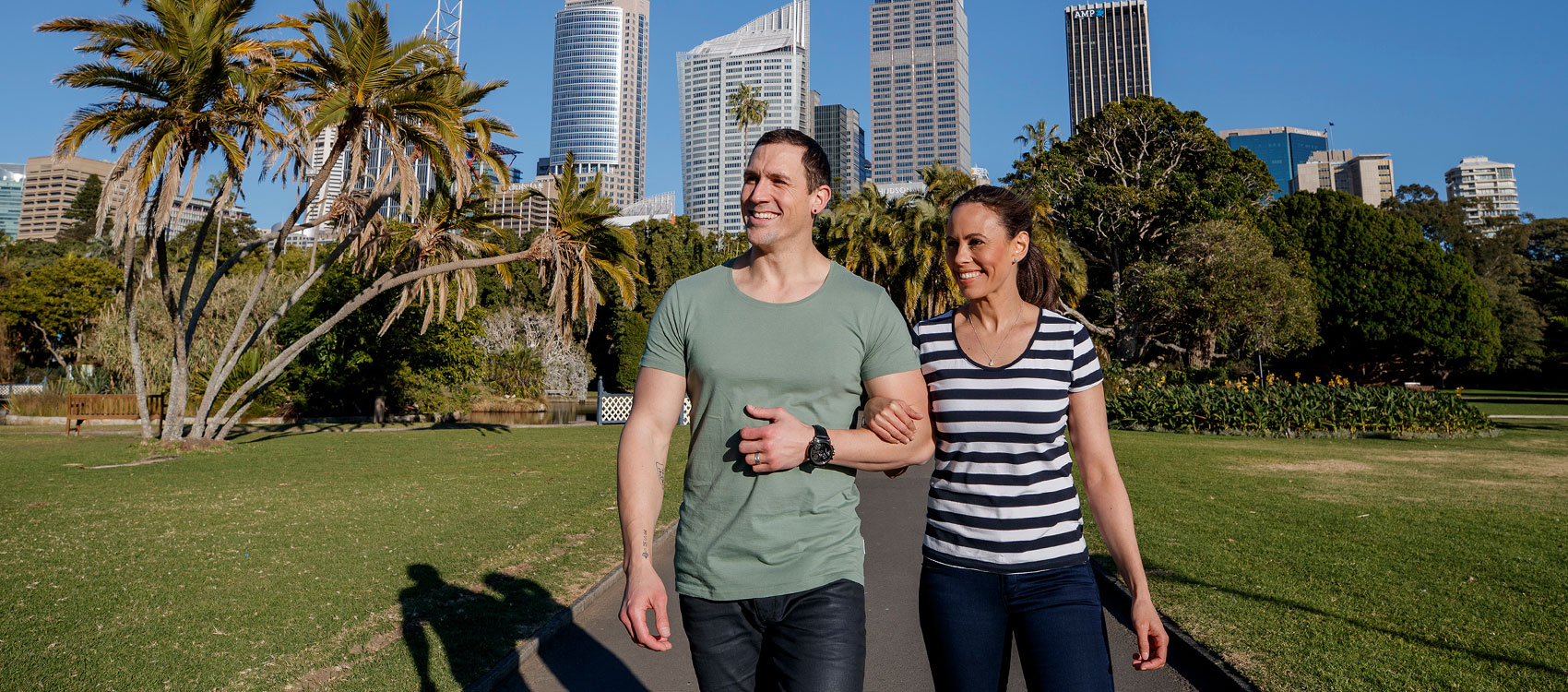 Two people walking through The Royal Botanic Garden Sydney