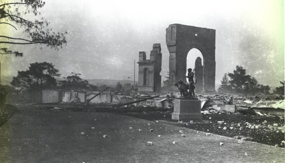View over the ruins left by the fire on the night of the 22nd September 1882. The statue of the Huntsman & Dog in foreground​