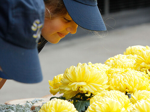 Children smelling flowers