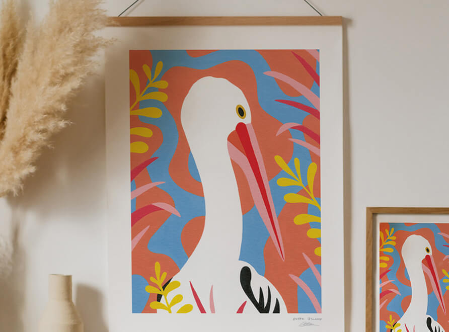 Sunny Pelican art print framed and hung on wall