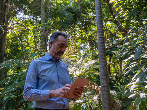 Scientist Maurizio Rossetto collects field data with a tablet