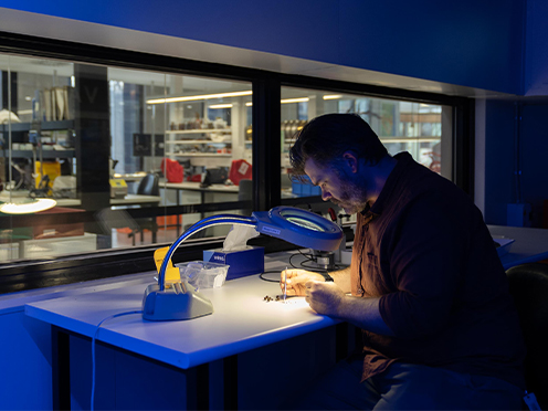 Scientist Nathan Emery examines seeds in a research lab