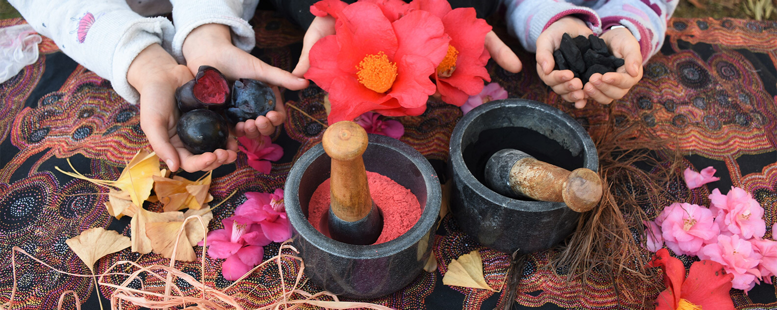 bowls of natural dyes, flowers and fruits