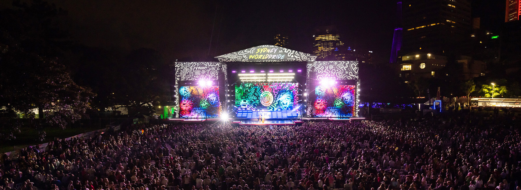 WorldPride stage at night, with thousands of people around it. Credit: Daniel Boud