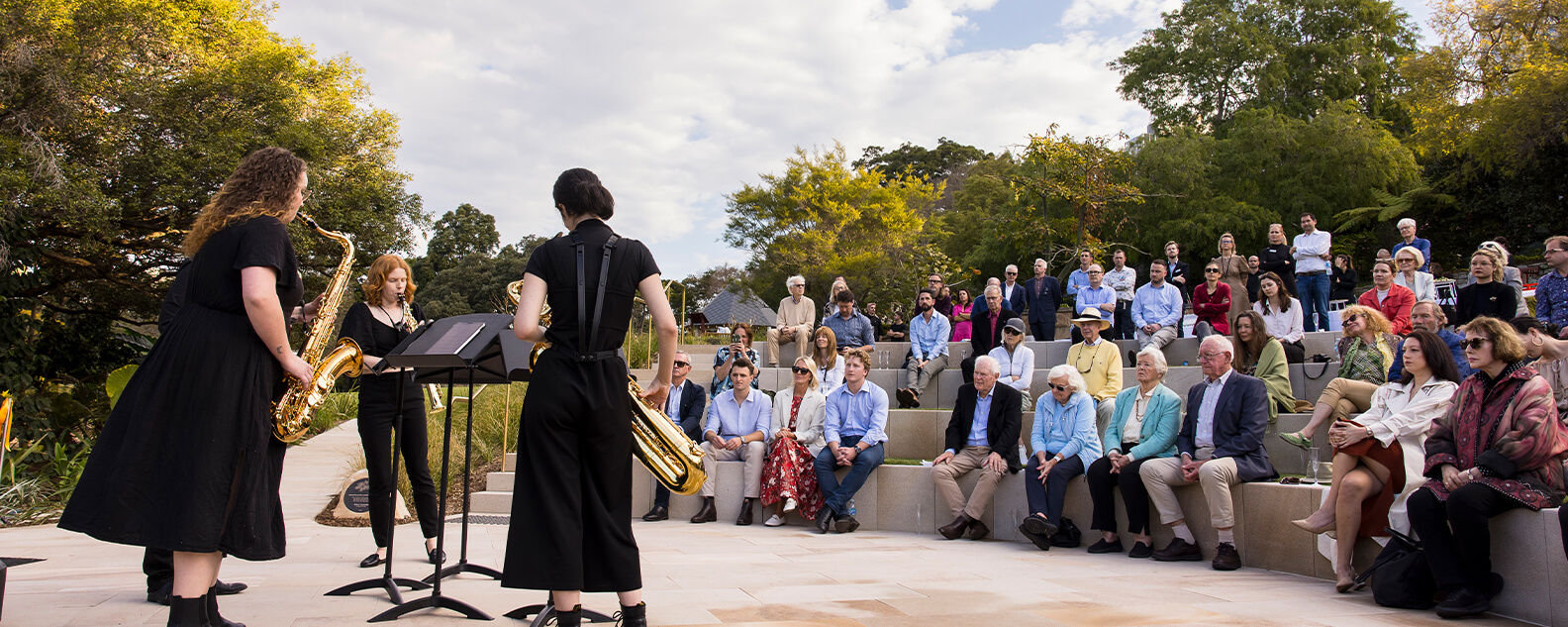 Saxophonists perform in amphitheatre in Garden