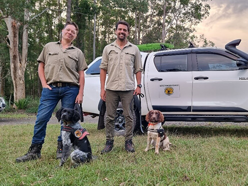 Tate animal trainers with two detective dogs