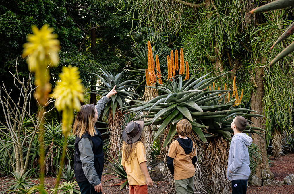 Kids exploring the Garden with a guide