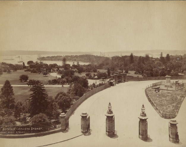 Domain Entrance from Macquarie Street, c. 1890. Domain Gates in Macquarie Street showing view of Harbour, fountain, statue [Bourke]. Photo by Charles Kerry
