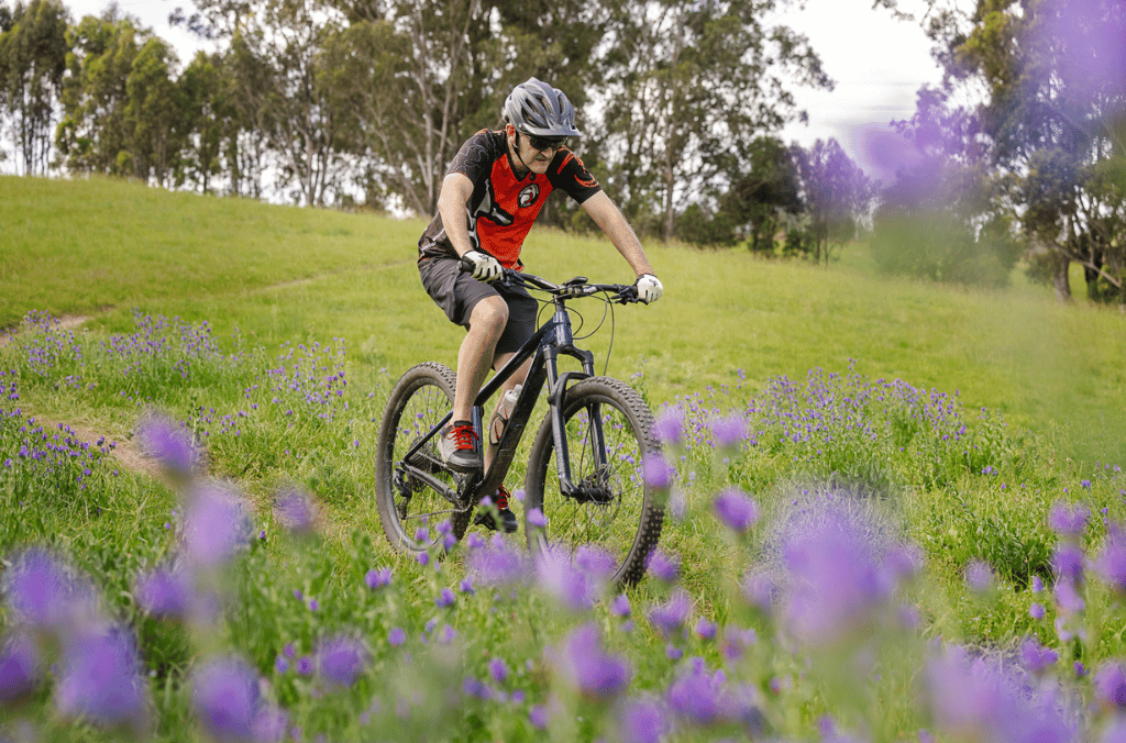 a man cycling on a path