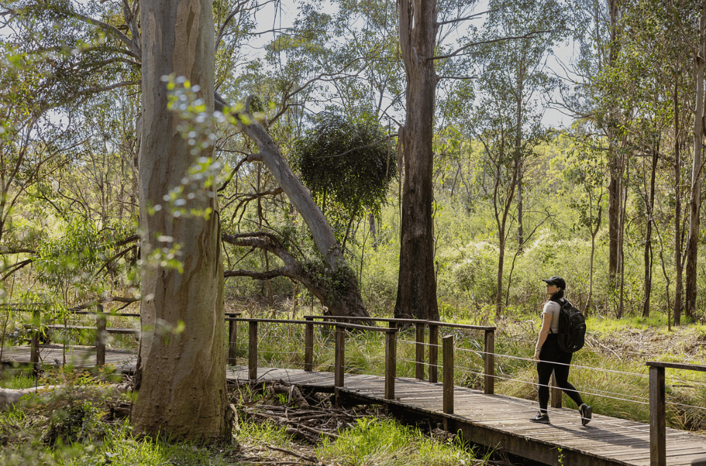 A woman walking on a path in the woodland