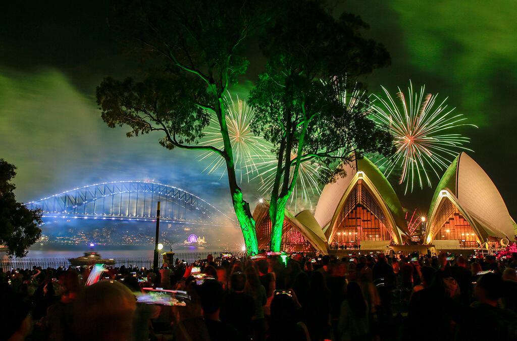 New Year's Eve fireworks from Bennelong Lawn, with view of Sydney Opera House and Harbour Bridge.