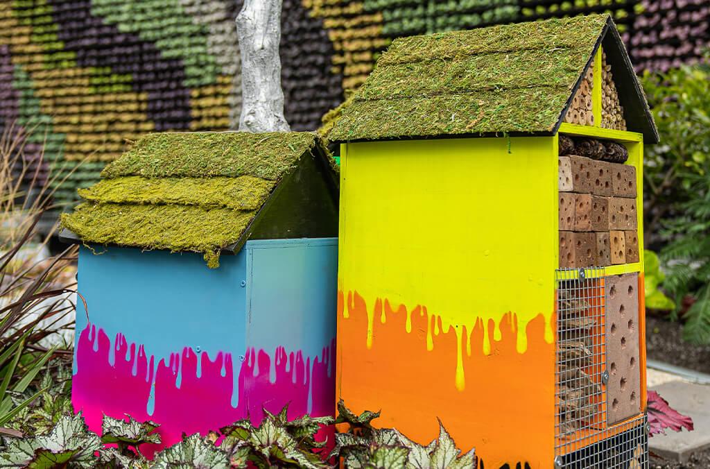 Brightly painted insect hotels