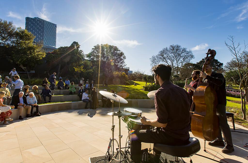 Students from the Conservatorium of Music perform in Garden on a sunny day