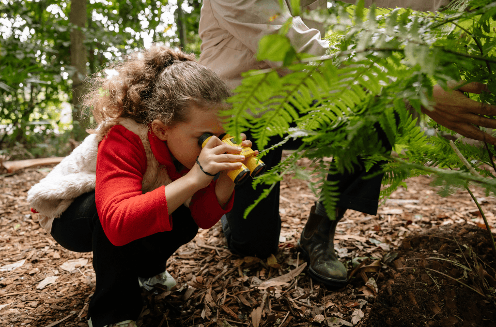 events-wildlife-explorers-kid-looking-at-plants-1024x676.png